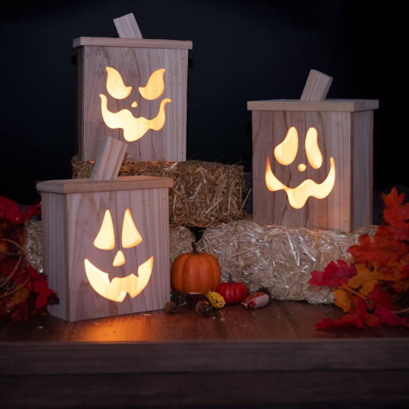 Three rustic cedar Jack O' Lanterns